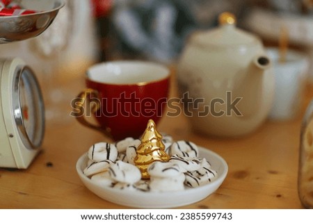 Cup of christmas hot chocolate with marshmallows, gingerbread and cookies on marble table