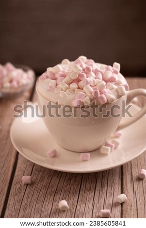 photo sweet dessert, white and pink marshmallow lies in a cup of coffee with foam, close-up, enjoyment, minimalism, snack, cafe, atmosphere