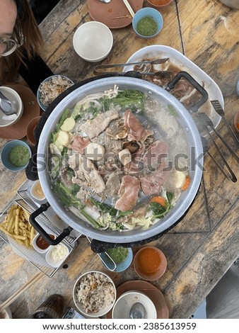 MOO KRA TA : Thai style pork BBQ on a hot pan Royalty-Free Stock Photo #2385613959