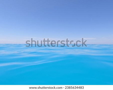 
Picture where the sea feels endless with a small sailboat