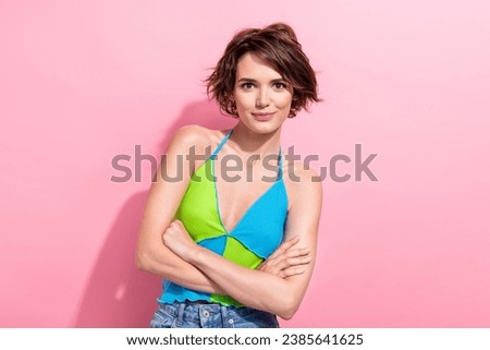Portrait of attractive young lady hold her hands folded good mood wear summer crop top jeans isolated pink color background