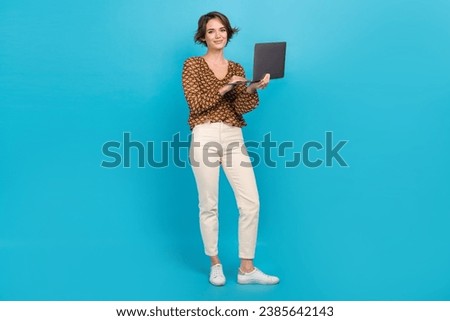 Full size photo of gorgeous nice girl hold use wireless netbook coworking isolated on blue color background