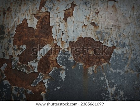    The texture of an old and rusted steel plate is used as a design                            