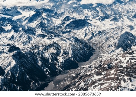 Aerial view of the snowy mountains of the Andes during spring between November and December 2023.