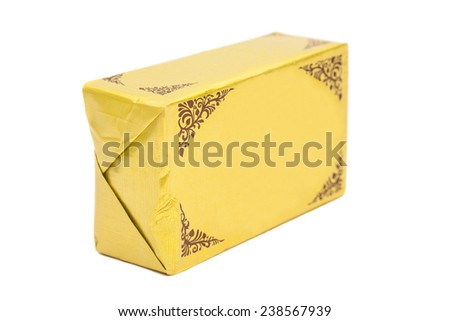 Stick of wrapped butter on white background. Royalty-Free Stock Photo #238567939