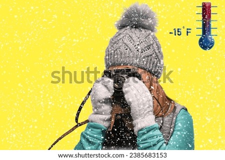 A 10-11 year old girl in winter clothes is taking photographs; it is snowing outside. The child is interested in his hobby and takes pictures in the extreme cold.
