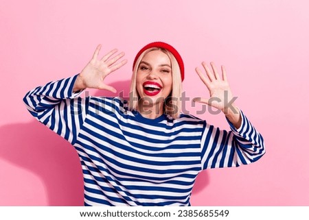 Portrait of funny young positive woman showing fingers high five symbols waving palms nonverbal language isolated on pink color background