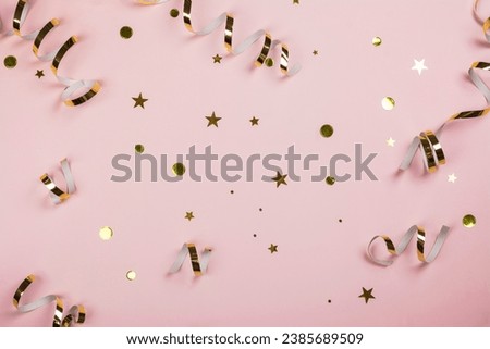 Christmas pink background with golden gift boxes, decorations and shiny stars. Copy space. Top view