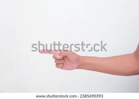 A person hand with index finger pointing to the right direction