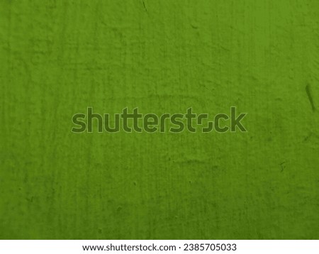 the walls are light green with a grainy texture