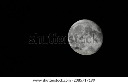 Full moon against the black night sky