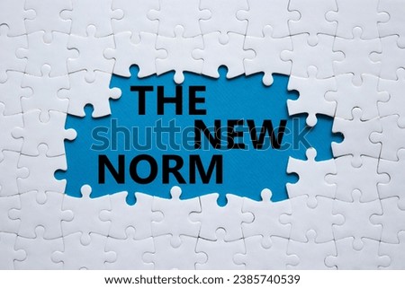 The new norm symbol. Concept words The new norm on white puzzle. Beautiful blue background. Business and The new norm concept. Copy space. Royalty-Free Stock Photo #2385740539