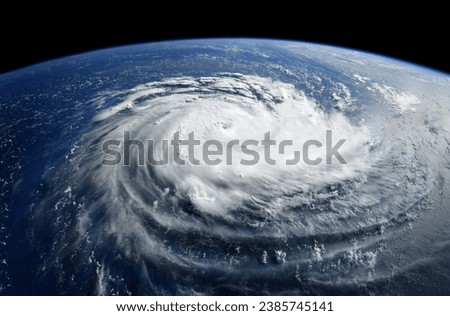 Super Typhoon, tropical storm, cyclone, hurricane, tornado, over ocean. Weather background. Typhoon,  storm, windstorm, superstorm, gale moves to the ground.  Elements of this image furnished by NASA. Royalty-Free Stock Photo #2385745141