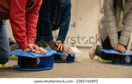 Emergency and Standard First aid and CPR training class by security guard in office
