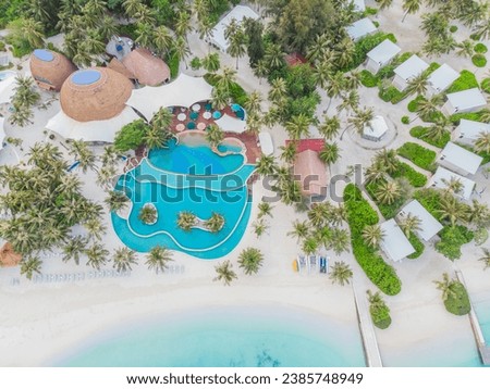 View from a flying drone of the luxury beach against the background of the beauty of the sea with coral reefs. Aero Photography of beautiful paradise tropical beach on island. Top View.