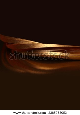 Abstract glow backgound. Gold (bronze) paper wave on black reflection light and shadow background. 