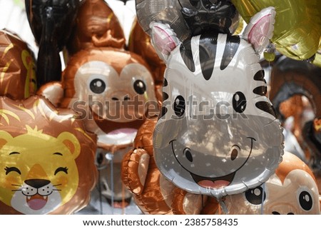 Lots of helium balloons in the store Royalty-Free Stock Photo #2385758435