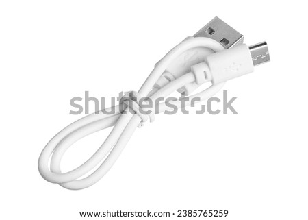 Micro-USB cable isolated on white background. High quality photo Royalty-Free Stock Photo #2385765259