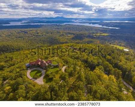 Castle in the Clouds aka Lucknow mansion aerial view in fall at the top of Lee Mountain with Lake Winnipesaukee and Ossipee Mountains at the background in town of Moultonborough, New Hampshire NH, USA