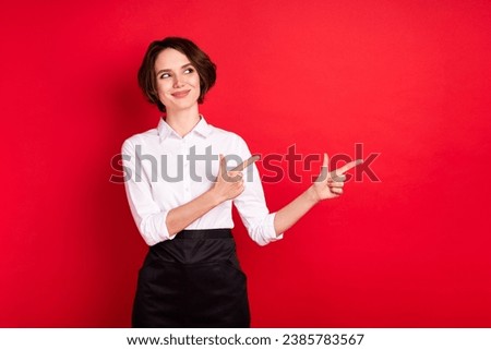 Photo of optimistic nice brunette hair lady point look empty space wear shirt isolated on red color background