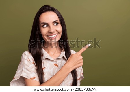 Photo of attractive young business lady pointing finger empty space beauty products for daily using isolated on khaki color background