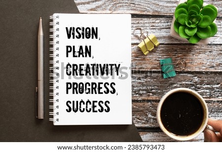 Male hand placing a block with word 'success' on top of a blocks tower with words 'vision, plan, creativity, progress'. Wooden table. Beautiful white background. Copy space, business concept.
