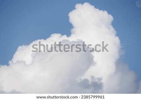 white cumulus clouds in blue sky, beautiful view of the sky and storm clouds. Huge majestic cloud phenomena. nature atmosphere ecology weather. Storm warning, weather change before storm thunderstorm