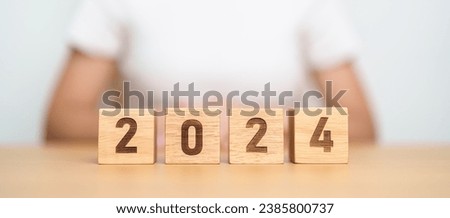 2024 year block on table. goal, Resolution, strategy, plan, start, budget, mission, action, motivation and New Year concepts
