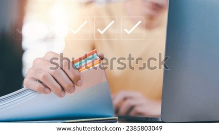 Accountant showing office document auditing concept ,plan review process and assess correctness ,Management of important document storage of organization ,document system ,accountant Audit documents	