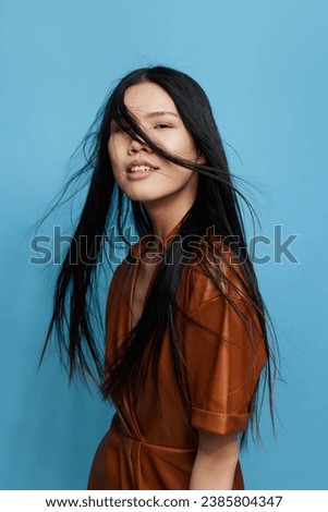 Trendy woman attractive studio blue girl asian portrait happy smile background lifestyle