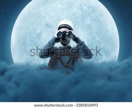 helmsman with binoculars and cap over night clouds viewing to the starry sky Royalty-Free Stock Photo #2385810493