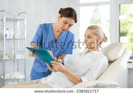 Woman writing, signature or sign on paper with doctor at hospital. Female healthcare professional consulting on medical insurance document or form. Discuss surgery compliance together in office.