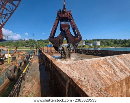 Usually the main of dredging is to create a greater depth of water. Dredging systems can either be shore-based, brought to a location based on barges, or built into purpose built vessels. Royalty-Free Stock Photo #2385829533