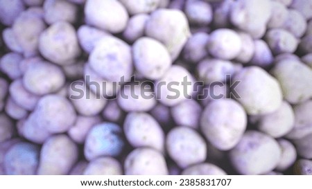Defocused abstract background photo of  pale brown potatoes. Good for full frame wallpaper.