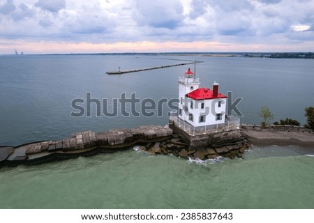 Aerial view of Fairport harbor west breakwater light house in the middle of Lake Erie. Royalty-Free Stock Photo #2385837643