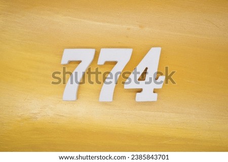 The golden yellow painted wood panel for the background, number 774, is made from white painted wood.