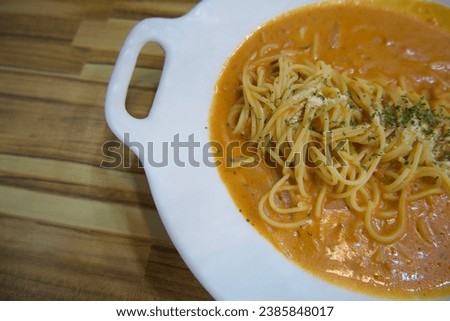 Pasta, spaghetti in a white plate, view from above