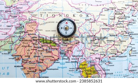 Map of countries in East Asia close up with a compass on it, world map focuses on the Middle East as a tourist destination country Royalty-Free Stock Photo #2385852631