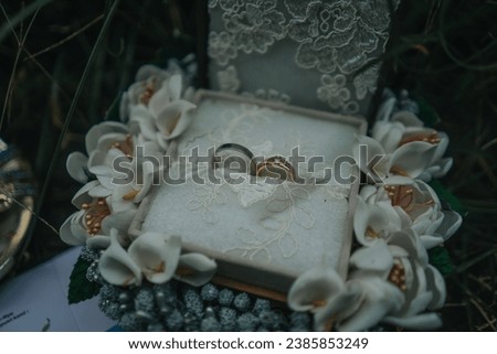 a beautiful flowery decorated wedding ring box 