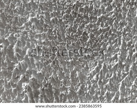 image of a wall made of rough textured cement