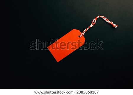Black Friday sale symbol: Red background, sale tag, and gift icon. Vector illustration is a festive discount.