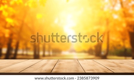 Concept Autumn nature and product advertising. copy space. The empty rustic wooden table for product display with blur background of autumn forest. Exuberant image. 
 background of autumn landscape. 