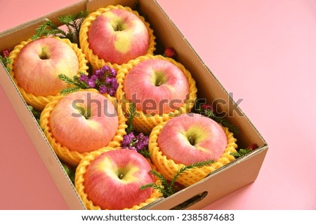 beautiful apple in the box on pink backgrond, healthy fruit