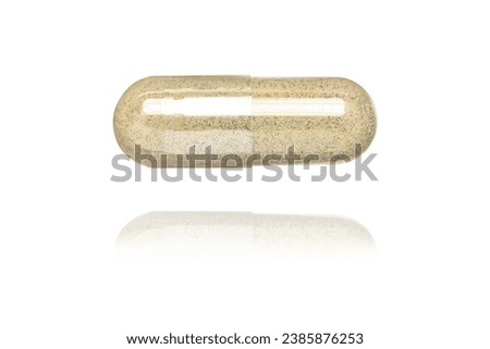 Brown powder herbal medicine capsule flying in the air isolated on white background.  Royalty-Free Stock Photo #2385876253