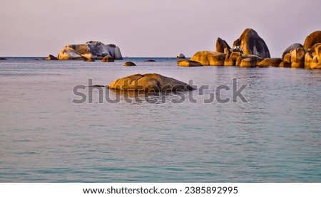 Large and tall granite rocks on the edge of Tanjung Tinggi beach, Belitung Island