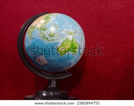 Picture of a globe with a reddened background