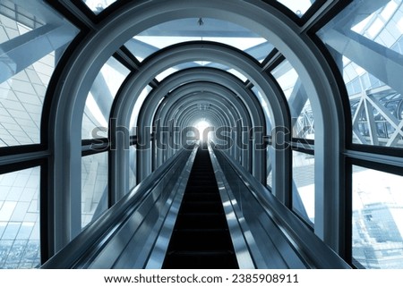 Long escalator ascent to the Umeda Sky Building. Royalty-Free Stock Photo #2385908911