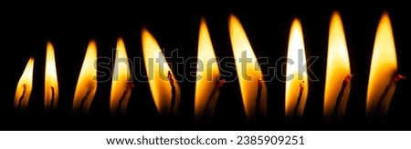 Candle flame on black isolated background. Light burning yellow-orange fire. Set collection Royalty-Free Stock Photo #2385909251