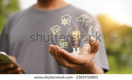 Farmer uses digital tablets in the agricultural field with smart farming interface icons and sunset light effects. Smart and new technology for agribusiness ideas. Royalty-Free Stock Photo #2385910803
