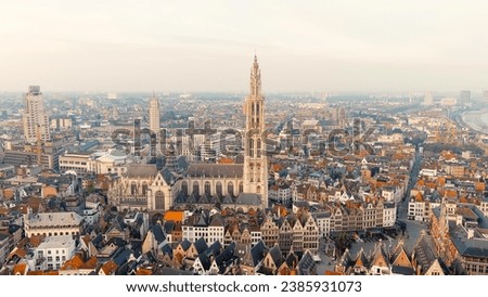 Antwerp, Belgium. Spire with the clock of the Cathedral of Our Lady (Antwerp). Historical center of Antwerp. City is located on river Scheldt (Escaut). Summer morning, Aerial View   Royalty-Free Stock Photo #2385931073